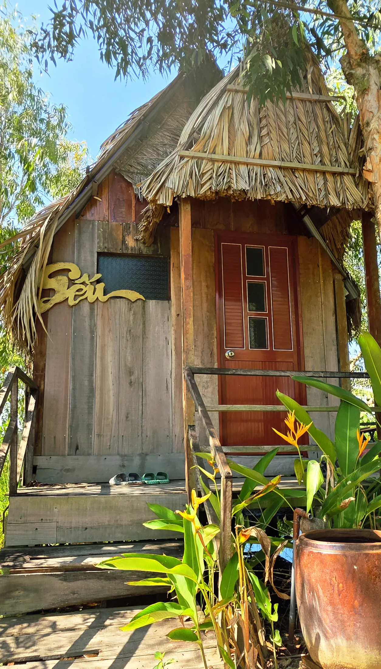 Entrance to the private bungalow beneath trees