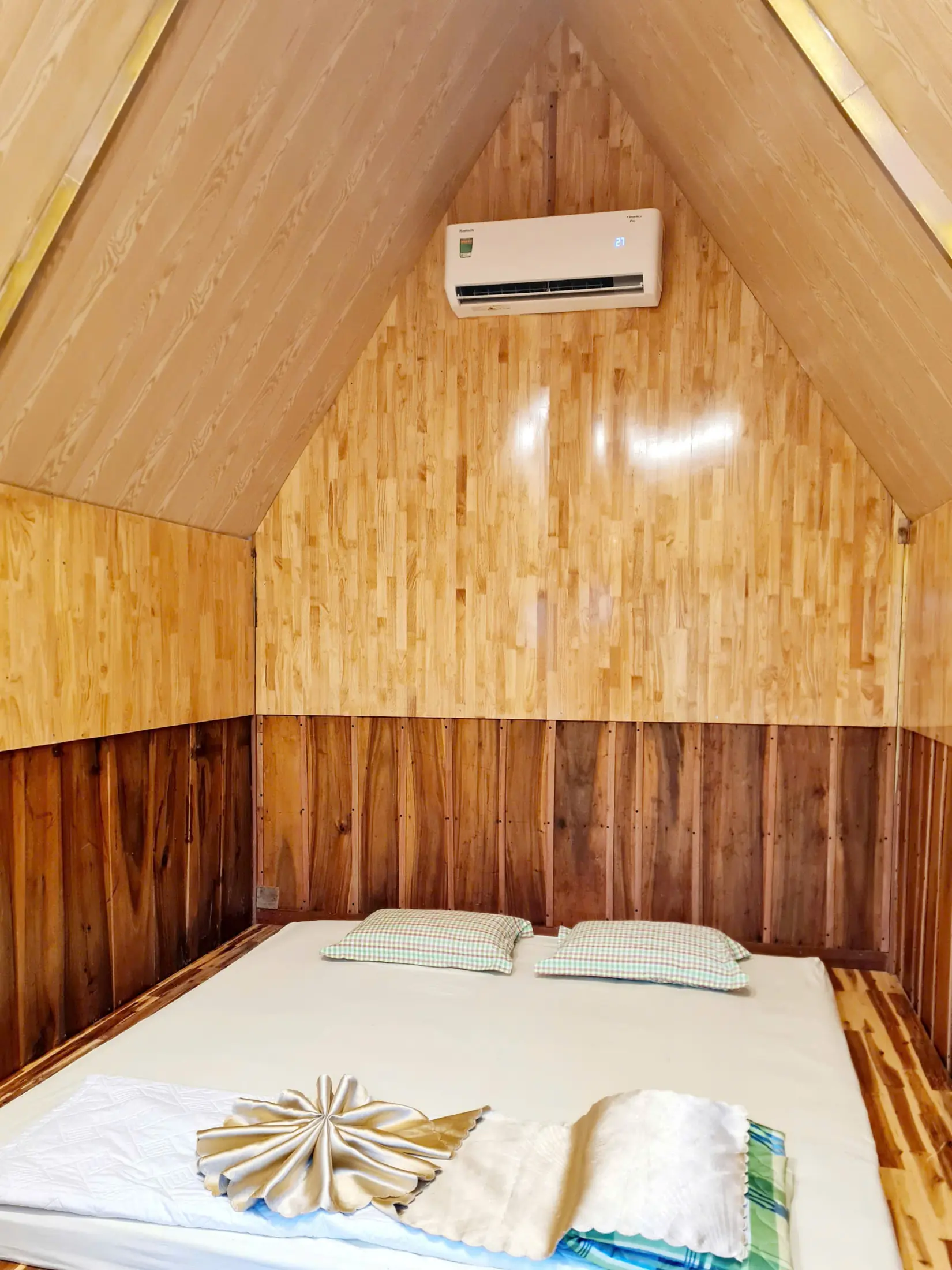 Air-conditioned timber bedroom inside the private bungalow