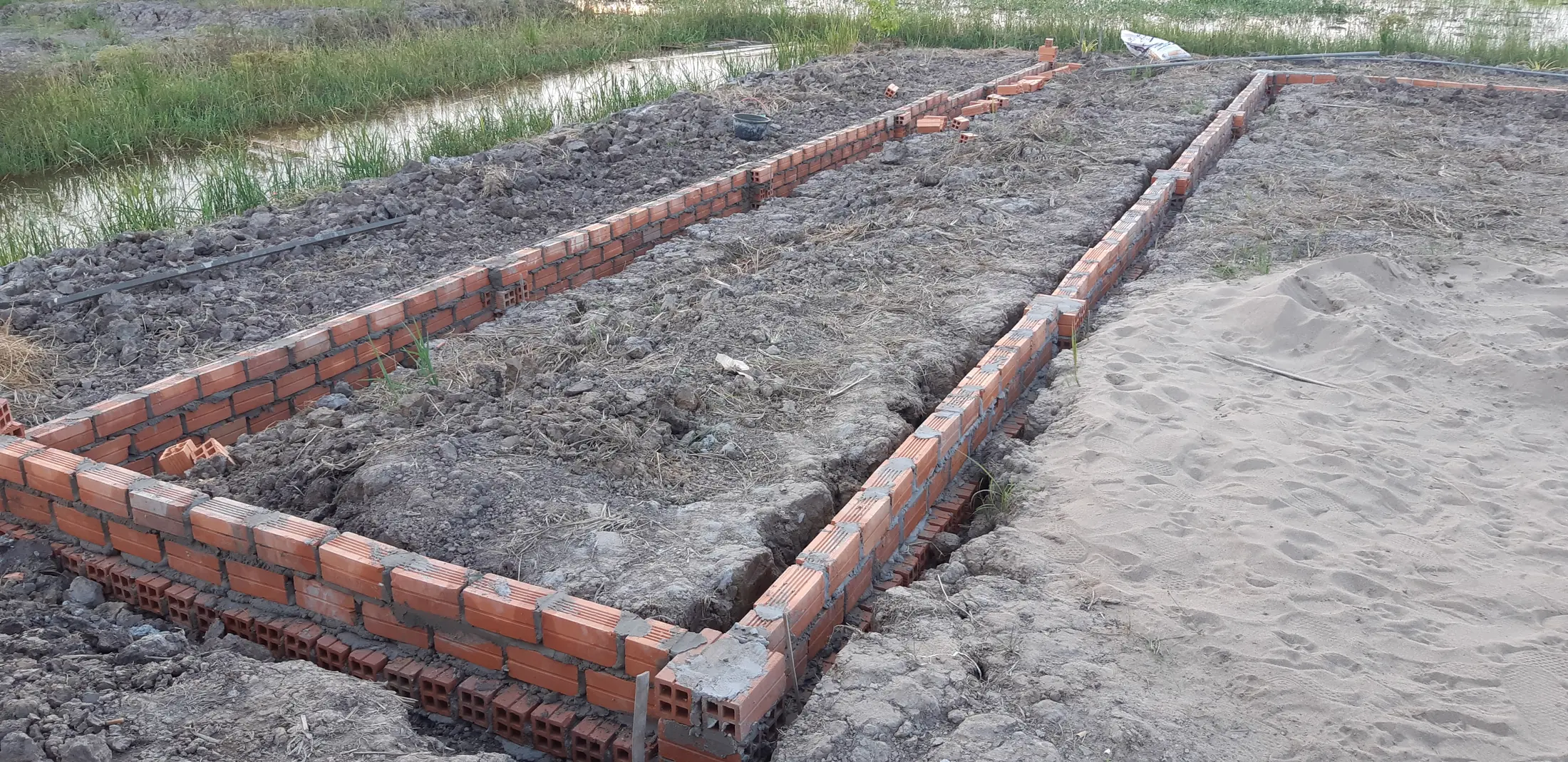 A simple brick foundation taking shape at the farmstay