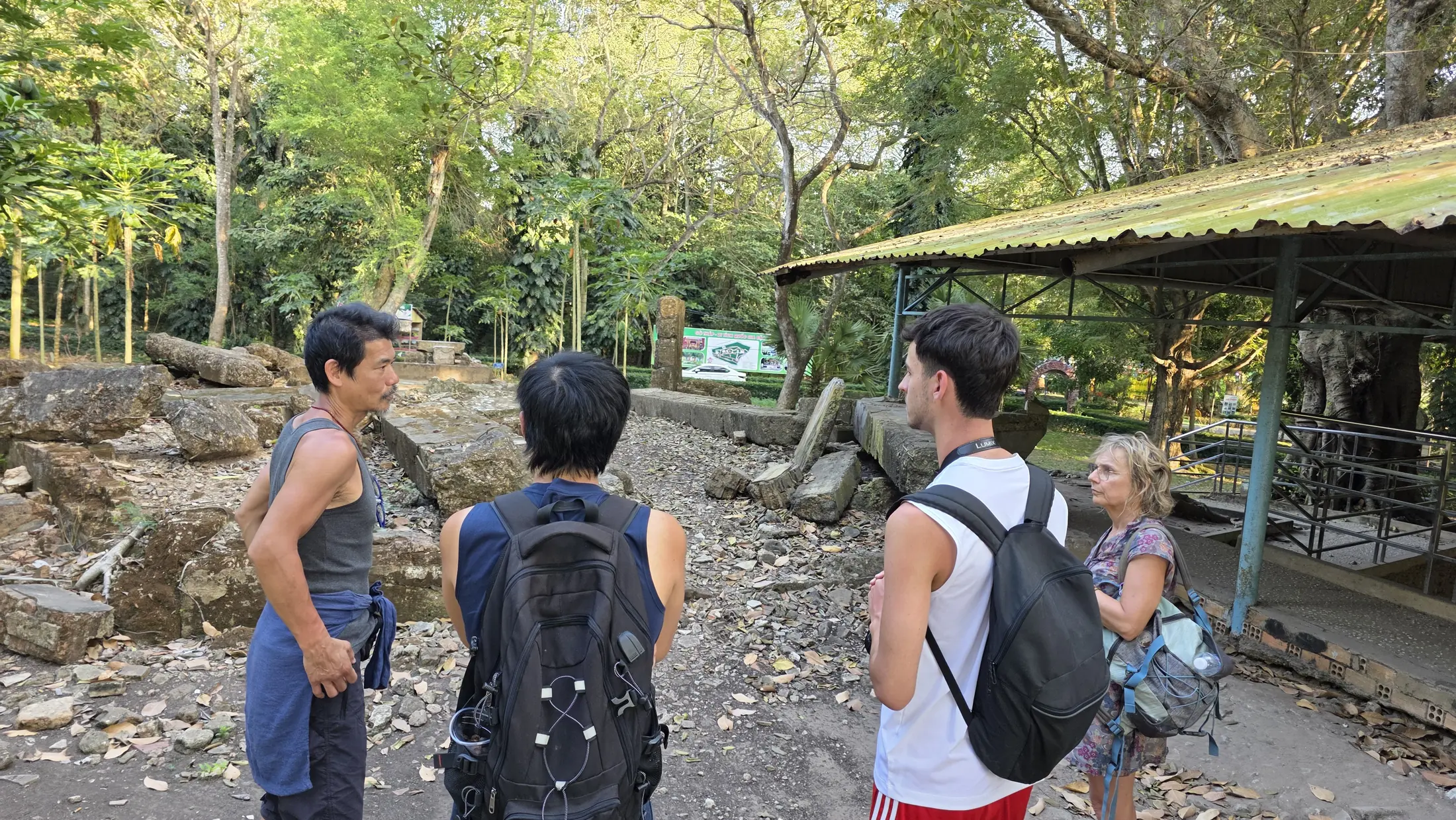 Visitors learning about the cultural landscape at Go Thap