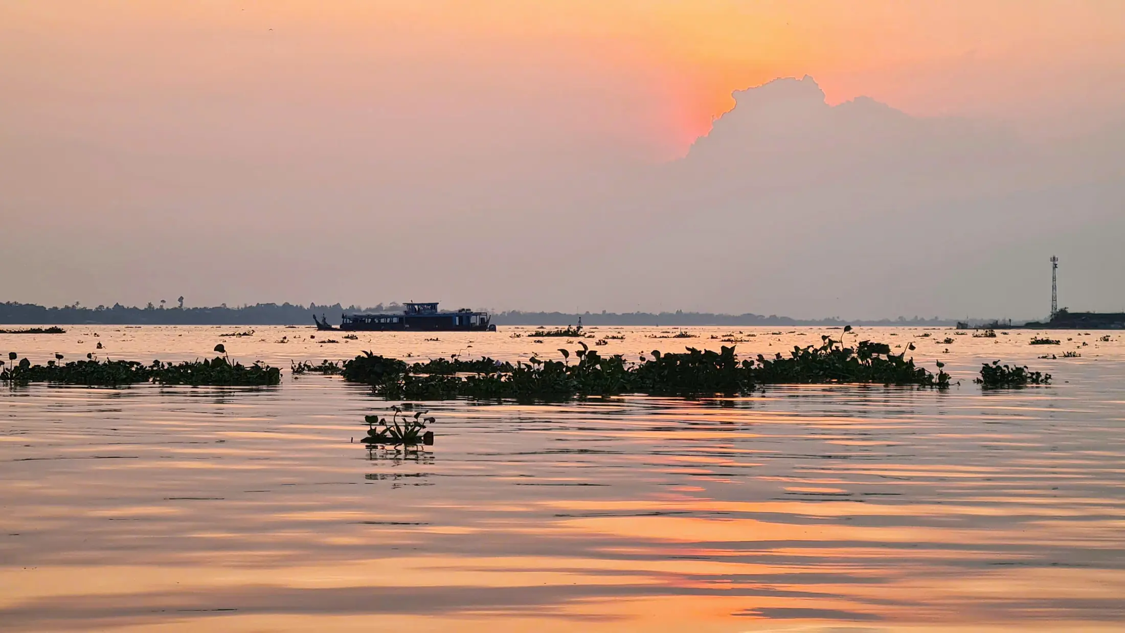 Warm sunset light spreading across the Mekong River